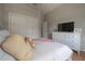 Comfortable bedroom featuring a large closet, dresser and bright natural lighting at 23268 Family Ln, Brooksville, FL 34602