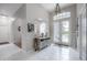 Inviting foyer with high ceilings, tiled floors, and an arched doorway at 23268 Family Ln, Brooksville, FL 34602