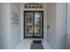 Elegant double front doors with glass panels and decorative accents at 23268 Family Ln, Brooksville, FL 34602