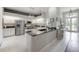 Modern kitchen with stainless steel appliances, granite countertops, and white cabinets at 23268 Family Ln, Brooksville, FL 34602
