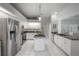 Spacious kitchen featuring modern appliances, granite countertops, and center island at 23268 Family Ln, Brooksville, FL 34602