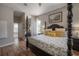 Bright and cozy main bedroom, hardwood floors, large windows, and ensuite bathroom at 23268 Family Ln, Brooksville, FL 34602