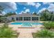 Backyard featuring a pool, spa and covered seating areas ideal for entertaining at 23268 Family Ln, Brooksville, FL 34602