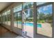 View from the sunroom to the backyard pool and spa area, perfect for relaxation at 23268 Family Ln, Brooksville, FL 34602