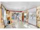 View of a living room with partial wall, flooring and ceiling coverings at 10044 Oana St, New Port Richey, FL 34654