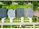 An aerial view showcases the property's boundaries, roof, and surrounding neighborhood landscape at 1015 W Charter St, Tampa, FL 33602