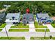 Aerial view of a charming home with a well-manicured lawn and mature trees at 1015 W Charter St, Tampa, FL 33602
