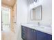 Bathroom featuring a blue vanity with white countertop and modern fixtures at 1015 W Charter St, Tampa, FL 33602