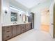 Bathroom with double vanity, and a view to a spacious bedroom at 1015 W Charter St, Tampa, FL 33602