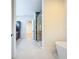 Bathroom view showcasing glass shower and an adjacent bonus room at 1015 W Charter St, Tampa, FL 33602
