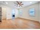 A bright and airy bedroom featuring light wood floors, contemporary ceiling fan, and ample natural light at 1015 W Charter St, Tampa, FL 33602