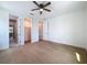 Bedroom featuring hardwood floors, ceiling fan, and ensuite bathroom access at 1015 W Charter St, Tampa, FL 33602