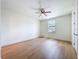 Bedroom features wood floors, ceiling fan, and window providing natural light at 1015 W Charter St, Tampa, FL 33602