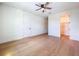 Bedroom featuring wood floors, ceiling fan and a door leading to a closet at 1015 W Charter St, Tampa, FL 33602