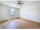 Bedroom featuring hardwood floors, ceiling fan, and a window at 1015 W Charter St, Tampa, FL 33602