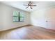 Bedroom with light hardwood floors and a large window showing exterior foliage at 1015 W Charter St, Tampa, FL 33602