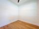 Bright bedroom features beautiful hardwood floors and a neutral color palette at 1015 W Charter St, Tampa, FL 33602