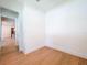 Bedroom with beautiful hardwood floors; doorway offers a view of the home's interior at 1015 W Charter St, Tampa, FL 33602