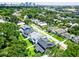 An elevated shot reveals a tranquil neighborhood alongside a picturesque river and a distant city skyline at 1015 W Charter St, Tampa, FL 33602