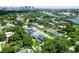 An elevated shot reveals a tranquil neighborhood alongside a picturesque river and a distant city skyline at 1015 W Charter St, Tampa, FL 33602