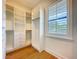 Bright walk-in closet with custom shelving and a window, creating a functional space at 1015 W Charter St, Tampa, FL 33602
