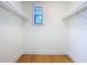 Walk-in closet showcasing built-in shelving and a window at 1015 W Charter St, Tampa, FL 33602