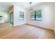 Dining room featuring backyard views, modern lighting and hardwood floors; kitchen view at 1015 W Charter St, Tampa, FL 33602