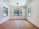 Dining room with hardwood floors, modern lighting, and bright, backyard views at 1015 W Charter St, Tampa, FL 33602