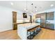 Spacious kitchen with a large center island, modern appliances, stylish pendant lighting, and ample cabinet space at 1015 W Charter St, Tampa, FL 33602