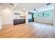 Spacious living room featuring hardwood floors, wall paneling, and built-in cabinetry at 1015 W Charter St, Tampa, FL 33602