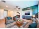 Bright and spacious living room with comfortable seating, a ceiling fan, and built-in storage at 1015 W Charter St, Tampa, FL 33602