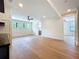 Living room features wood floors, ceiling fan, and access to the bathroom at 1015 W Charter St, Tampa, FL 33602