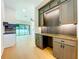 Stylish living area with fireplace, desk and sliding glass doors to outdoor space at 1015 W Charter St, Tampa, FL 33602