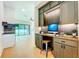 Stylish office space boasting custom built-ins, desk, and wood floors, ideal for a productive work environment at 1015 W Charter St, Tampa, FL 33602