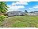 Spacious backyard showing the exterior of the house with a fenced-in area, perfect for outdoor activities at 1029 Madison St, Largo, FL 33770