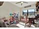 Bright playroom with a large window, desk, and a fun dollhouse, ideal for creative play at 1029 Madison St, Largo, FL 33770
