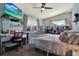 Comfortable bedroom features a desk, storage, TV, and large window at 1029 Madison St, Largo, FL 33770