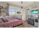 Bright bedroom featuring a cute pink daybed, gray walls and decor, and natural light from the window at 1029 Madison St, Largo, FL 33770