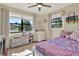 Bedroom bathed in natural light with multiple windows, soft colors, and decor creating a cozy ambiance at 1029 Madison St, Largo, FL 33770