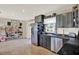 Well-lit kitchen featuring modern cabinets, stainless steel appliances, and neutral tile flooring at 1029 Madison St, Largo, FL 33770