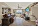Inviting living room featuring tile floors, a ceiling fan, and a large window with natural light at 1029 Madison St, Largo, FL 33770