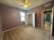 Bedroom featuring carpet, a ceiling fan, and a closet with double doors at 10621 Scenic Hollow Dr, Riverview, FL 33578