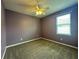 Bedroom featuring carpet, a ceiling fan, and a window with blinds at 10621 Scenic Hollow Dr, Riverview, FL 33578