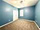 Bedroom featuring carpet, a ceiling fan, and a window with blinds at 10621 Scenic Hollow Dr, Riverview, FL 33578