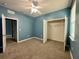 Bedroom featuring carpet, a ceiling fan, and a closet with double doors at 10621 Scenic Hollow Dr, Riverview, FL 33578