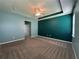 Comfortable primary bedroom featuring neutral carpeting and a ceiling fan at 10621 Scenic Hollow Dr, Riverview, FL 33578