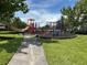 Community playground with slides, jungle gym and bench; a perfect place for outdoor fun at 10621 Scenic Hollow Dr, Riverview, FL 33578