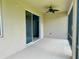 Relax in the screened patio with a ceiling fan and sliding glass door access to indoor living spaces at 10621 Scenic Hollow Dr, Riverview, FL 33578