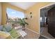Cozy balcony with seating area, plant, and views of the community at 10764 70Th Ave # 4305, Seminole, FL 33772