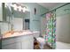 Bathroom featuring a vanity with mirror, decorative shower curtain and a decorative parrot at 10764 70Th Ave # 4305, Seminole, FL 33772